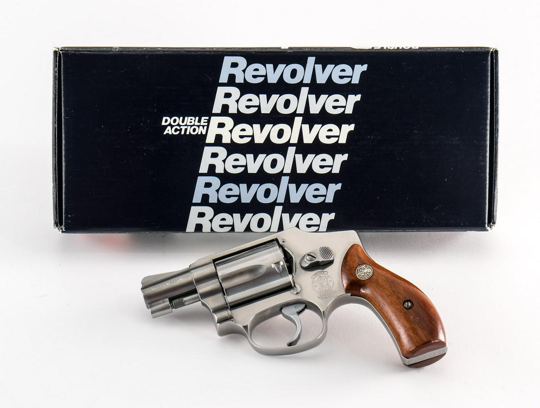 Smith & Wesson 640 Centennial .38 Spl Revolver: Smith & Wesson model 640 Centennial in .38 special with a five round capacity and a 2" barrel. The wood "SW" grip plates are in excellent condition and have no signs of wear. The polished stainless st