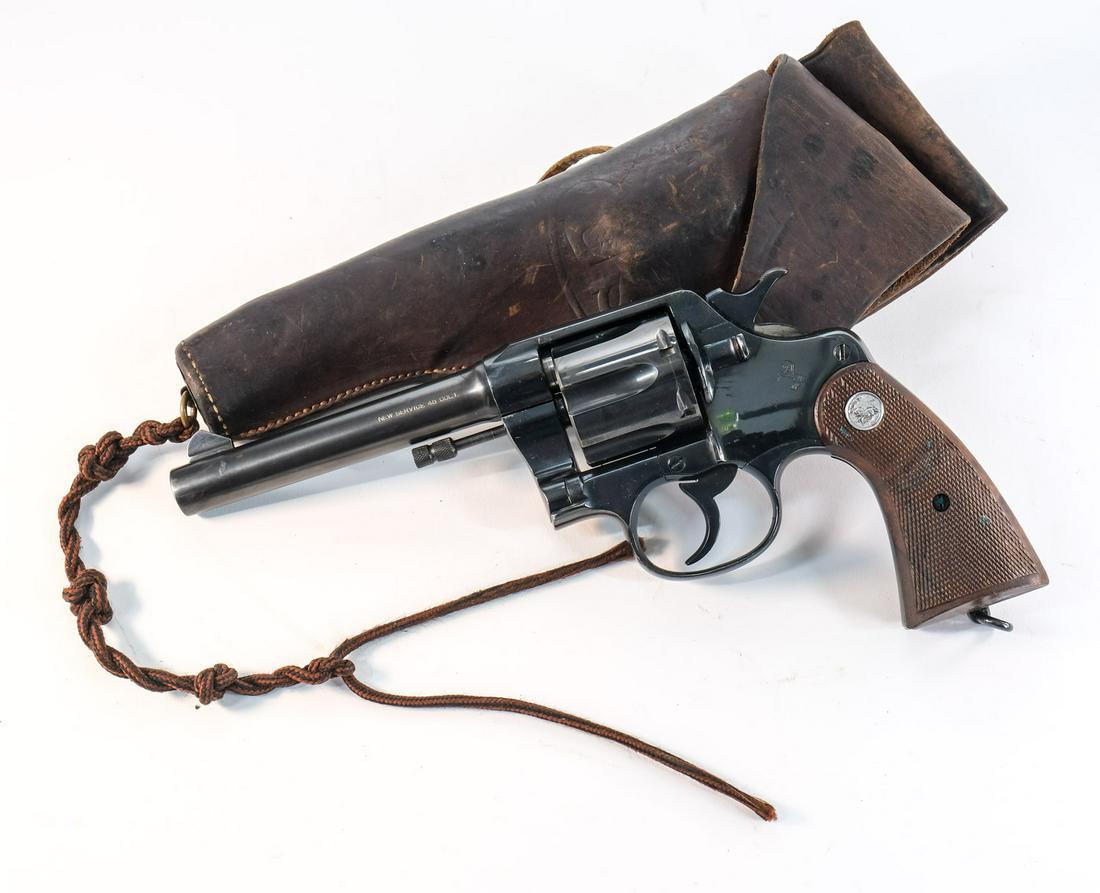 Colt New Service Army M1917 .45 Colt: Very attractive Colt New Service US Army model of 1917 .45 colt revolver with correct 1917 "US" holster. Frame has been refinished however the 5 3/8" barrel appears to have original bluing. Barrel may