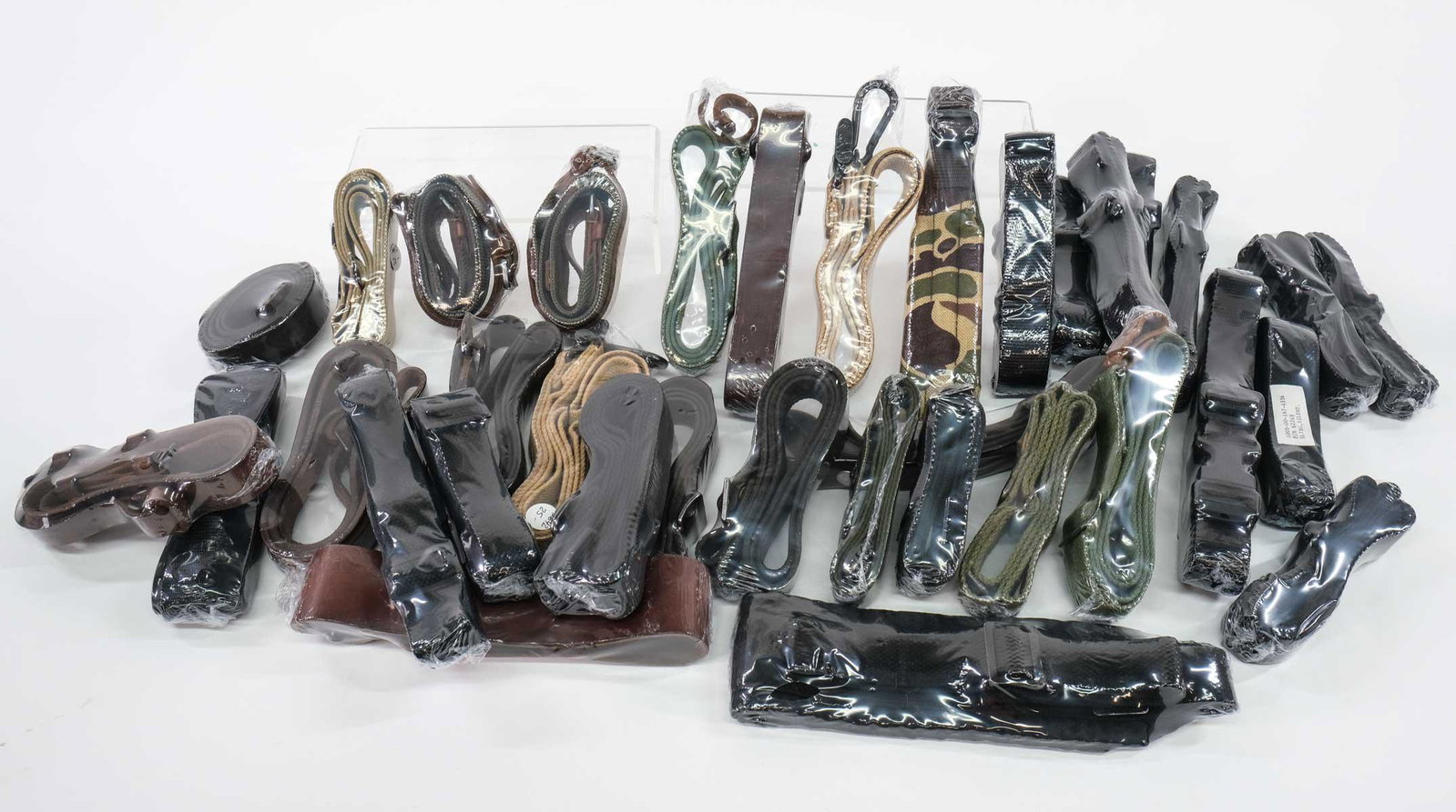 Surplus Military and Sporting Rifle Slings: Massive lot surplus Military and Sporting rifle slings. Includes WWII, Korean and Vietnam era type web and leather slings, SP1 web slings and a MG42 sling to name a few.