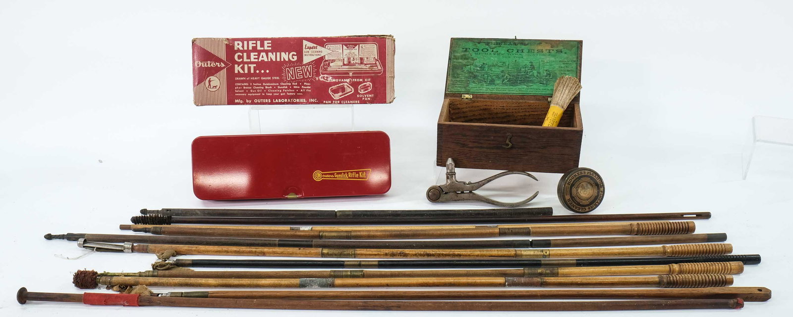 Vintage Gun Cleaning Supplies: A vintage Outers rifle cleaning kit, antique tool box with cleaning supplies, a reloading tool and pistol parts and 11 vintage rifle and shotgun cleaning rods.