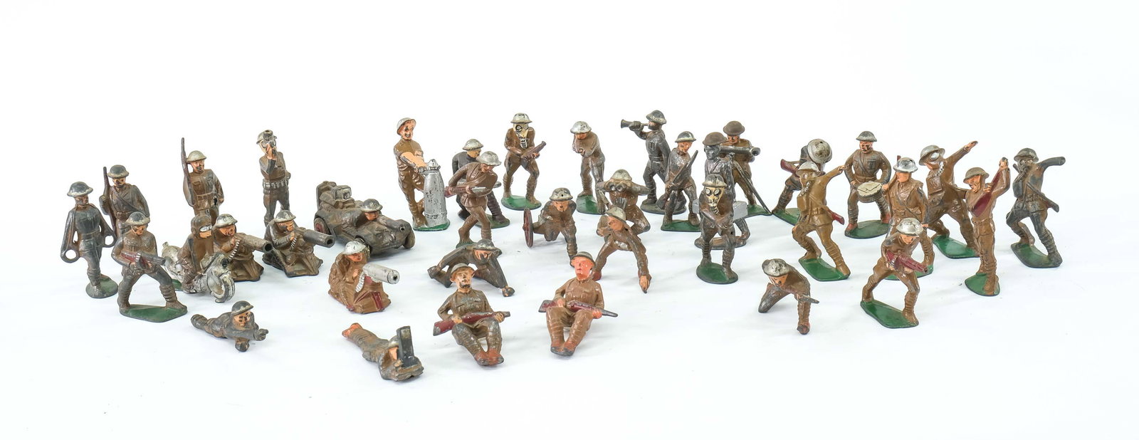 Dimestore WWI Toy Soldiers: over 35 pcs, mostly Manoil, some signed, A good original Lot with with original paint, and some better pieces including Motorcycle, Trench periscope, Gas Masks, etc. Keywords: Antique, Vintage, Cast M