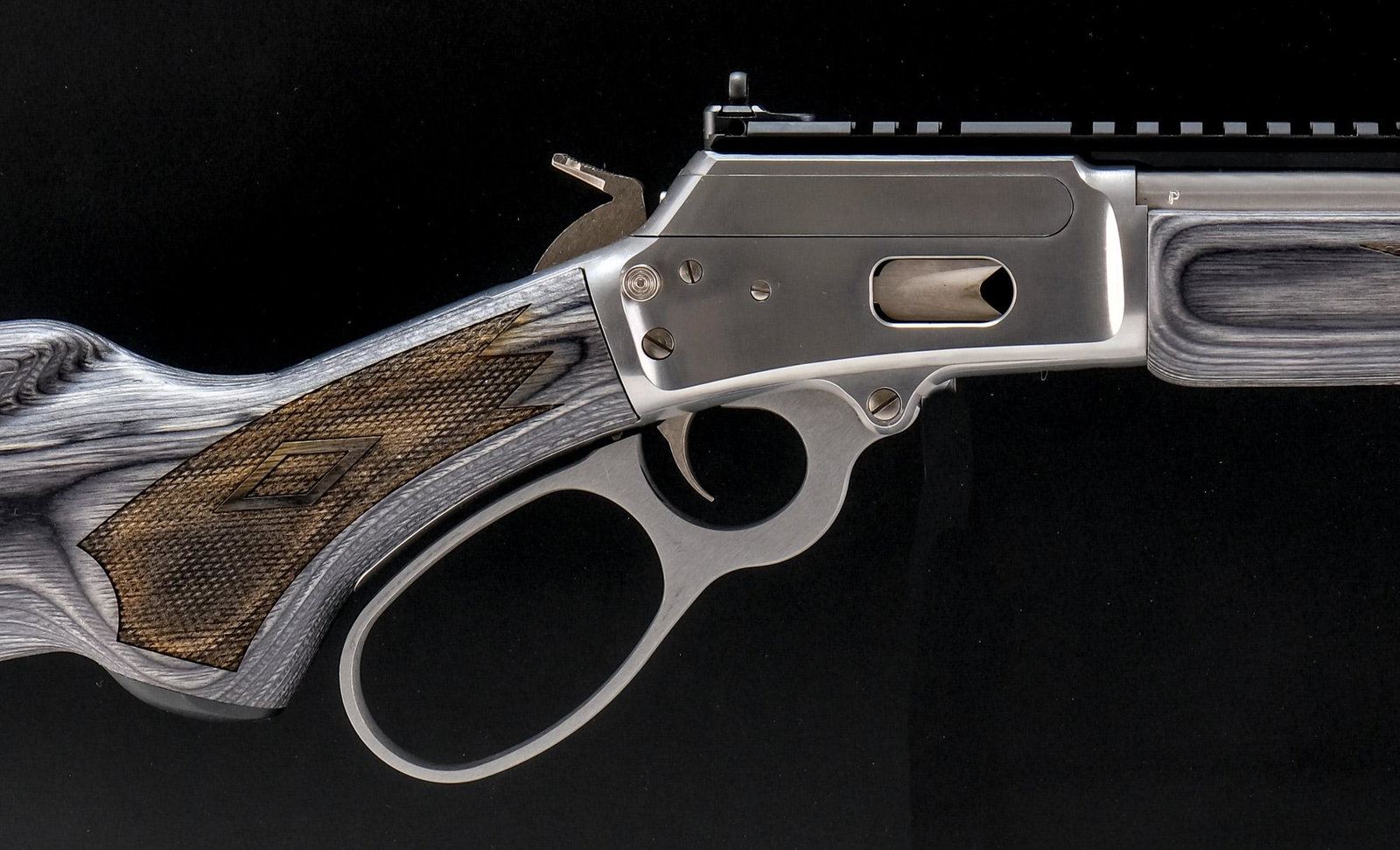 Marlin 1894 CSBL Rifle Big Loop .357 / .38: Beautiful all weather stainless steel Marlin lever action with gray laminate stock. Desirable compact 16.5" barrel with rear peep sight. Hard to find Big loop lever chambered in either .357 magnum or 