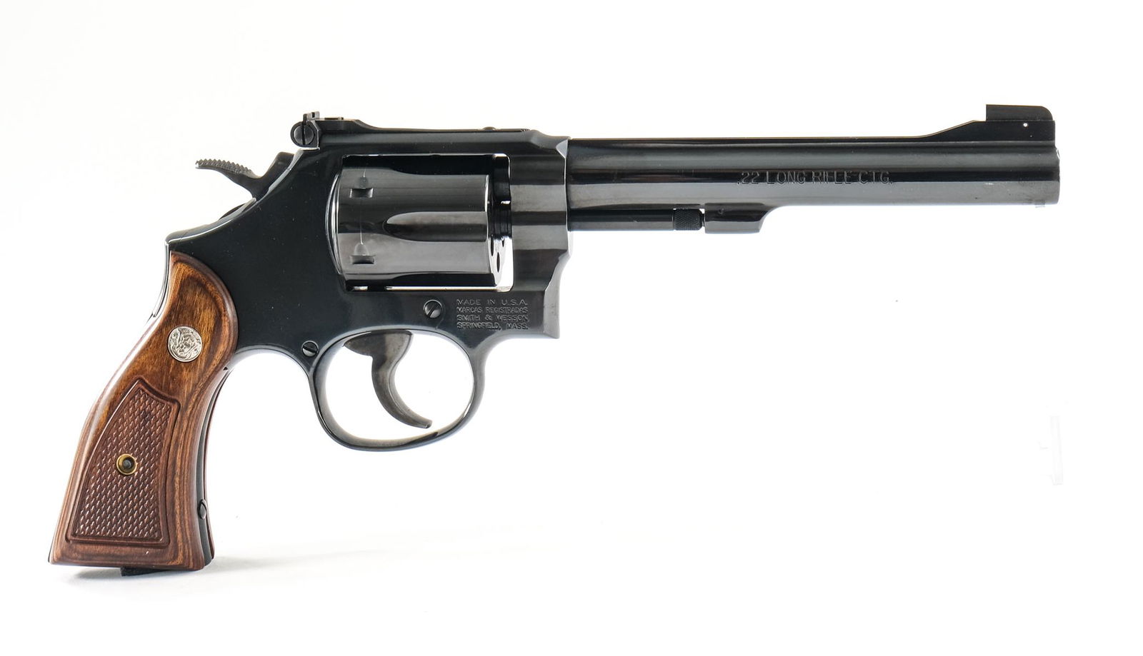 Smith & Wesson 17-9 .22 LR Revolver: S&W model 17-9 in .22 long rifle with a six round cylinder capacity and a 6" barrel. This double action revolver is brand new, never having been fired outside of factory testing. Walnut grip plates wi
