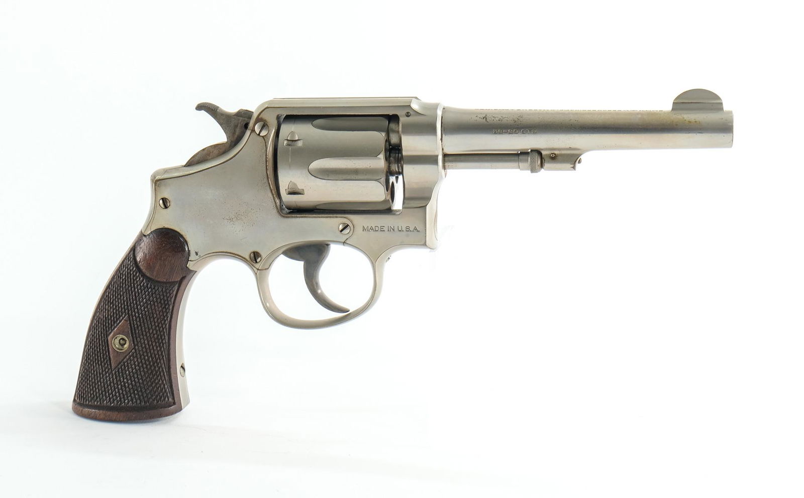 Smith & Wesson M1905 .32-20 "4th" Revolver: Smith & Wesson model 1905 in .32-20 CTG with a six round capacity and a 5" barrel. Checkered wood grip plates with light all-over wear no damage. The finish on the frame has wear on the edges and a to