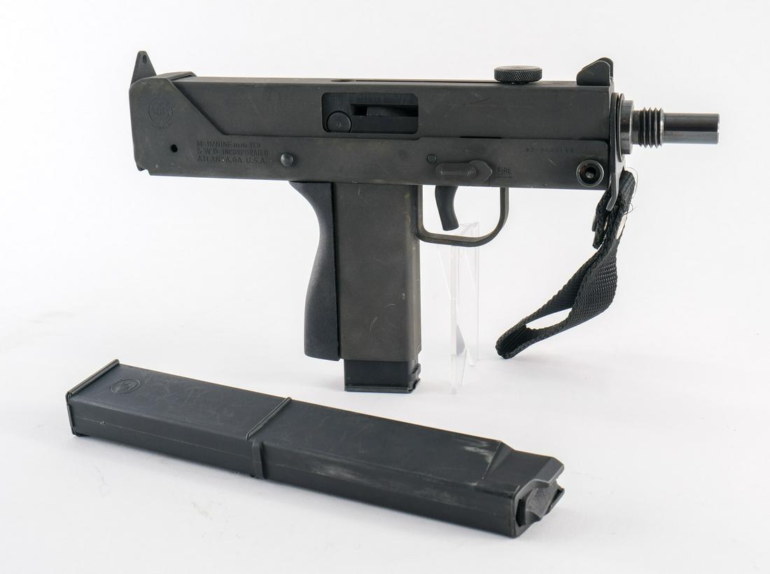 SWD Inc. M-11 9mm Pistol: S.W.D. Incorporated model M-11 in 9mm with one, fifteen round removable magazine and one, thirty round removable magazine. The large capacity mag is proofed "Cobray". The frame has touches of metal ox