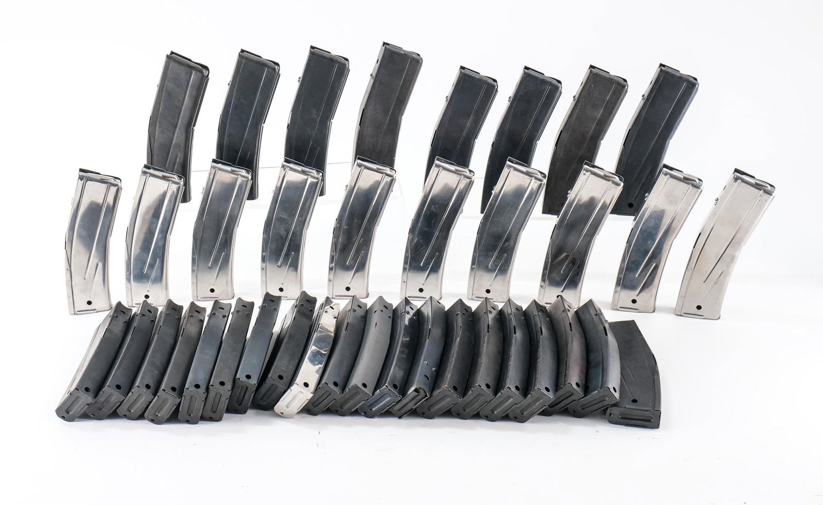 M1 Carbine Magazines (38): This lot is for thirty eight M1 Carbine, thirty round high capacity magazines. They are all unbranded and eleven are chrome magazines , one is "parkerized" and twenty six are black finished. They all 