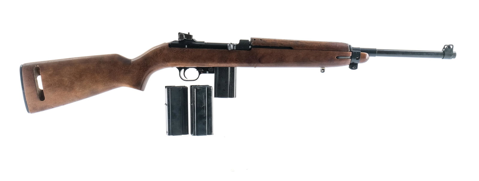 Universal M1 Carbine .30 CAL Rifle: Universal M1 Carbine in .30 caliber with three, ten round removable magazines and a 18" barrel. Metal butt-plate is in excellent clean condition. Hardwood stock is very clean and free of damage or hea