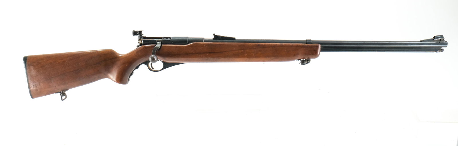 Mossberg 46B-B .22 Bolt Rifle: O.F. Mossberg & Sons model 46 B-B in .22 short and long rifle with a 26" barrel. Plastic butt-plate is in very good condition with no cracks or chips. Monte Carlo style wood stock has a few nicks, din