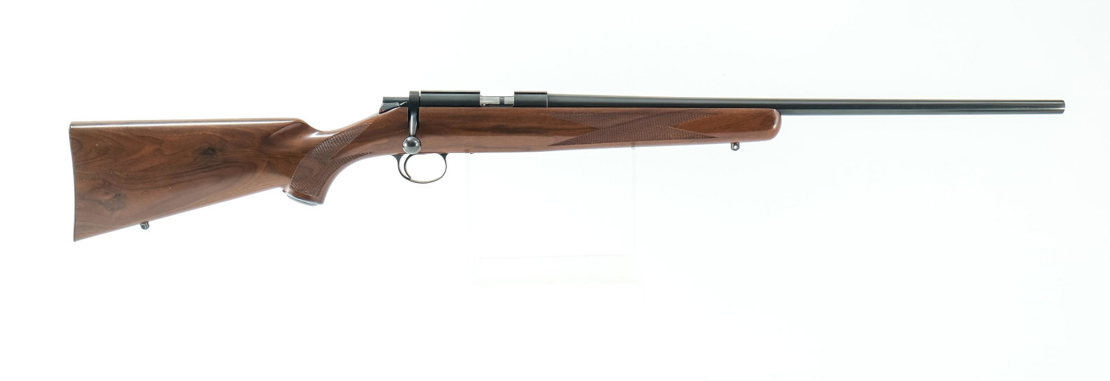 Kimber of Oregon model 82 .22 LR Rifle: Kimber model 82 in .22 long rifle with one, five round removable magazine and a 22" barrel. Very clean checkered metal butt plate. One piece wood stock has a few dings on the butt end and light scuffs