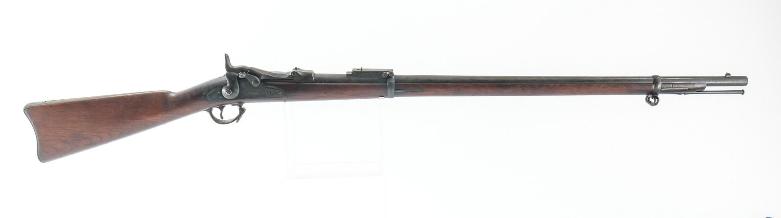 U.S. Springfield 1884 Trapdoor 45-70 Rifle: U.S. Springfield model 1884 Trapdoor with a single shot capacity in 45-70 with a 32" barrel. Metal butt plate with moderate wear and metal oxidation. Wood stock has, scratches, dings and a small chip 
