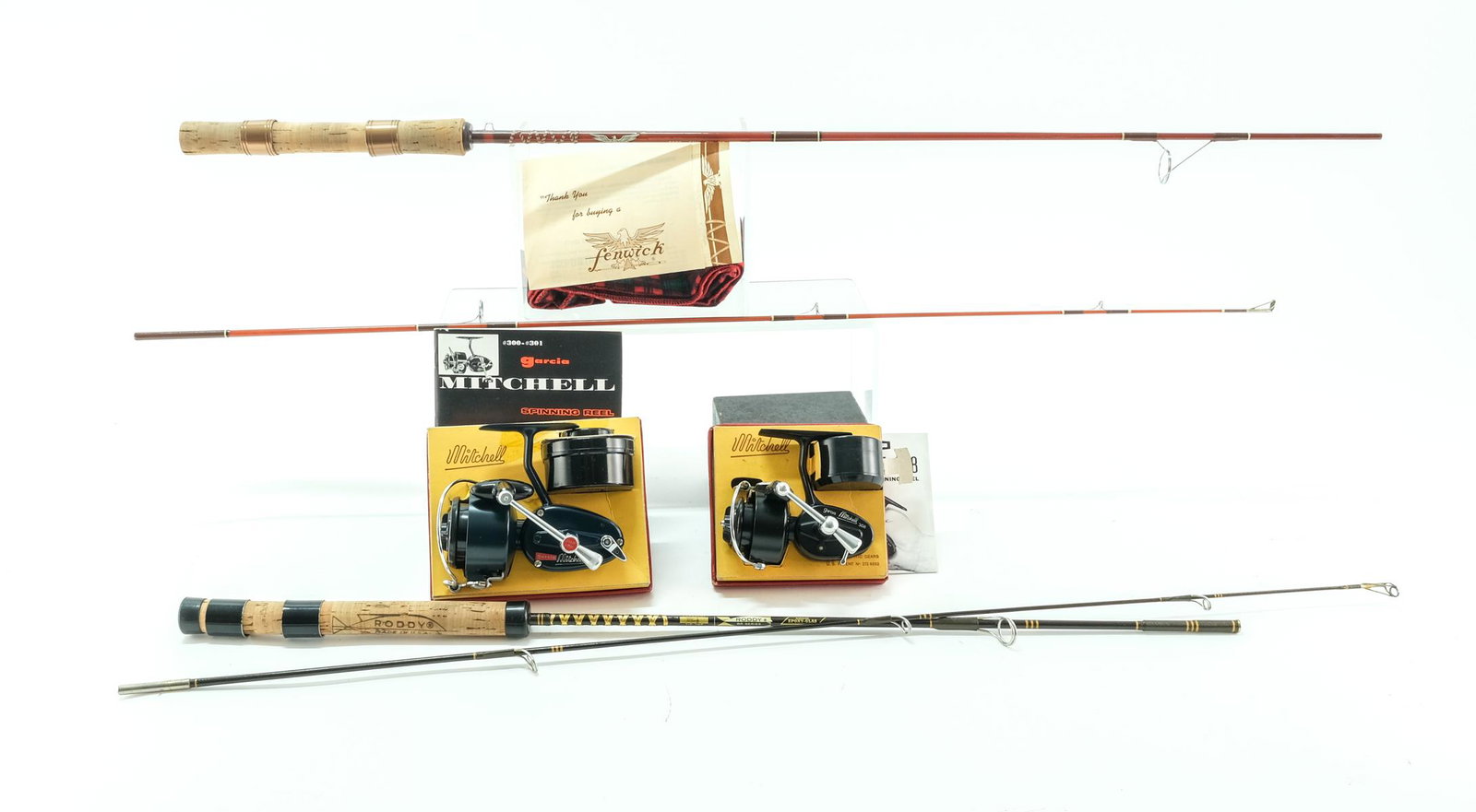 Vintage Spin Fishing Rods and Reels: Description Two Vintage Spinning Rods, and Two Vintage Spiing reels: A 5" Two-piece light weight BR 1/2 rod with pressure reel seat Epoxy-glass and Carbaloy Tip-Top rod by Roddy, and a Fenwick FS55 5.