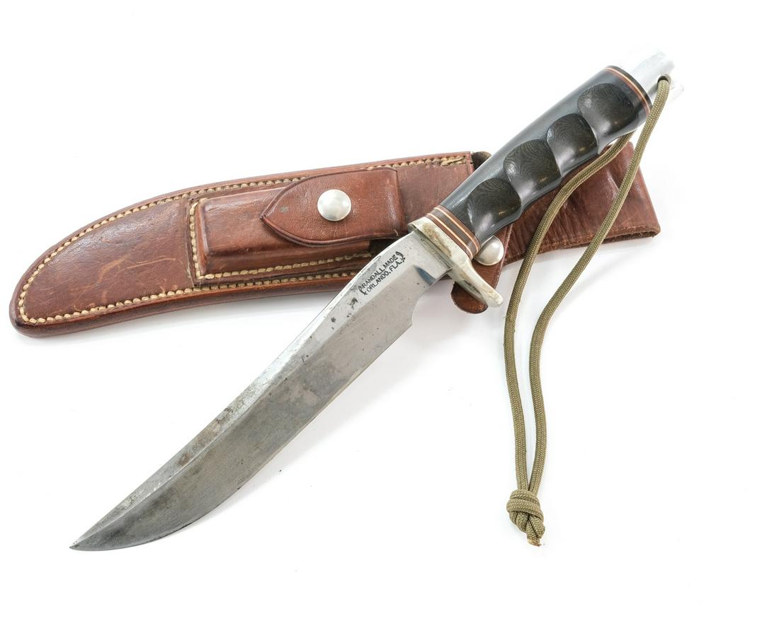 Randall #3 7" Hunter Sheath Knife: Description Randall Made Orland, FLA. 7" Blade, with Nickel Silver mounts, Finger-Groove Black/Green Micarta Handle, unlined thong-hole. 12" OAL, in original stitched Randall Sheath. Blade shows use a