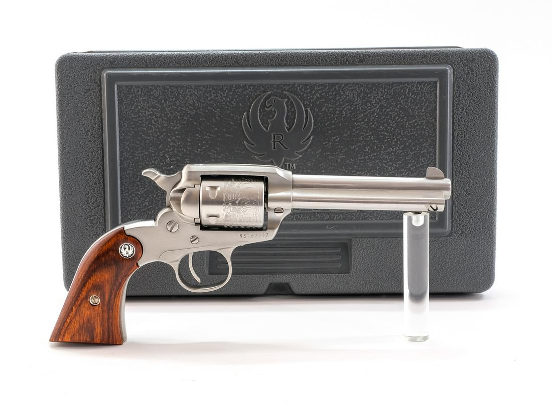 Ruger New Bearcat .22 SA Revolver: Description Ruger model New Bearcat in .22 caliber with a 4" barrel. Wooden grip plates. Stainless steel frame, cylinder, barrel, trigger and guard. Factory engraved cylinder and front fixed blade sig