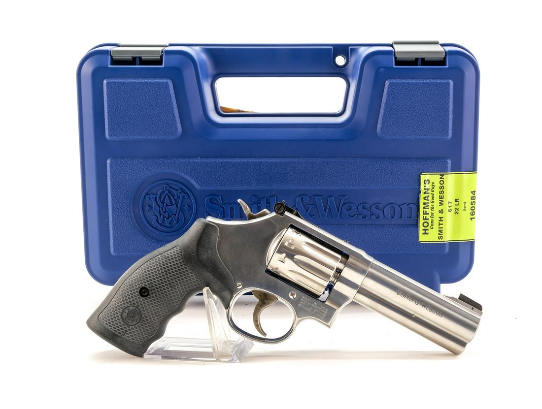 Smith & Wesson 617-6 .22 LR. Revolver: Description Smith & Wesson model 617-6 in .22 long rifle with a ten shot capacity and a 4" barrel. Rubber dotted grips. Case colored checkered hammer and smooth trigger. Stainless steel frame, barrel