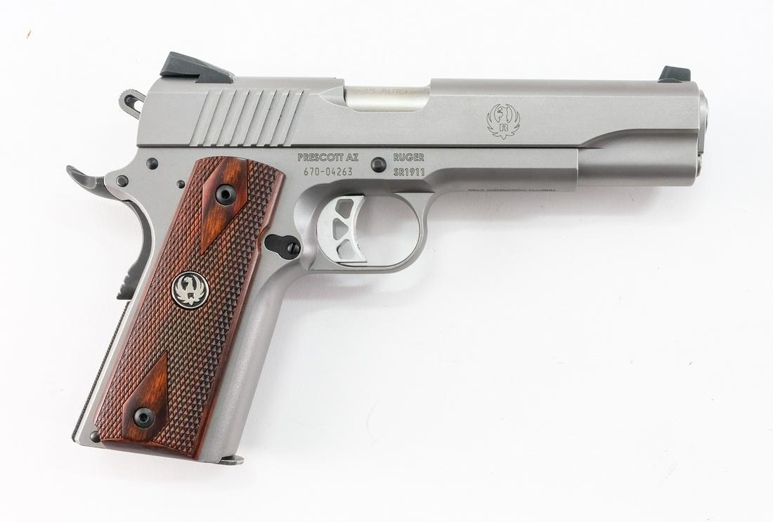Ruger SR1911 .45 Semi-Auto Pistol: Description Ruger model SR1911 in .45 caliber with three, ten round removable magazines and a 5" barrel. Solid wooden checkered grip plates. Matte finished steel frame and slide. Serrated trigger and 