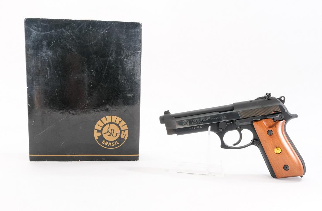 Taurus PT 99 AF 9mm Semi-Auto Pistol: Description Taurus model PT 99 AF in .9mm missing its removable magazine. Smooth solid wood grip plates. Parkerized metal frame, slide and barrel. Ambidextrous safety switch on the rear of frame. Adju