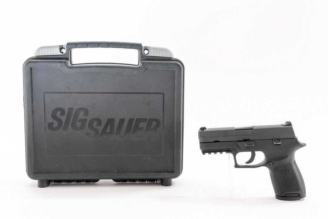 Sig Sauer P250 9mm Semi-Auto Pistol: Description Sig Sauer model P250 in .9mm with a ten round removable magazine and a 4" barrel. Composite frame and grips. Black metal slide, hammer, trigger and barrel. Left side of grip magazine relea