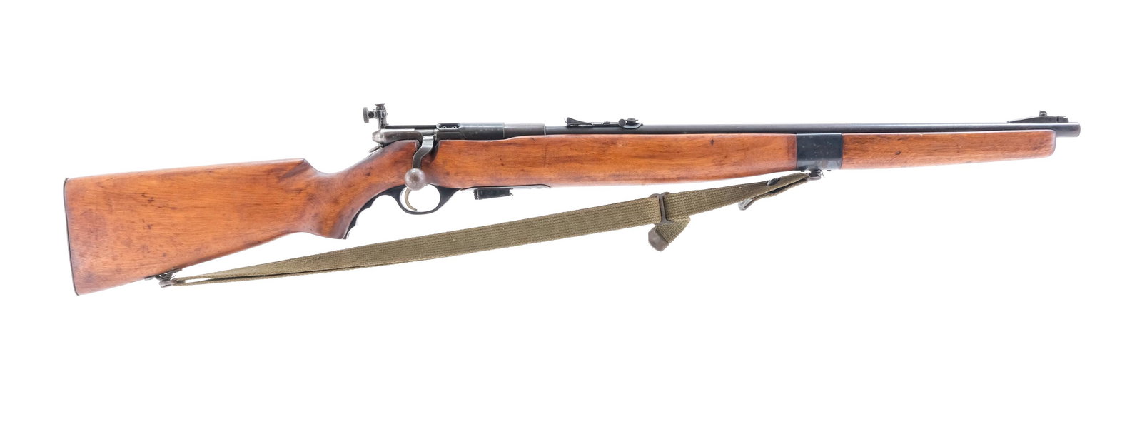 Mossberg 42M-B .22 Bolt Action Rifle US Property: Description Mossberg model 42M-B in .22 short, long and long rifle with a seven round removable magazine and a 23" barrel. Metal butt plate with storage door to hold an extra magazine, moderate metal 