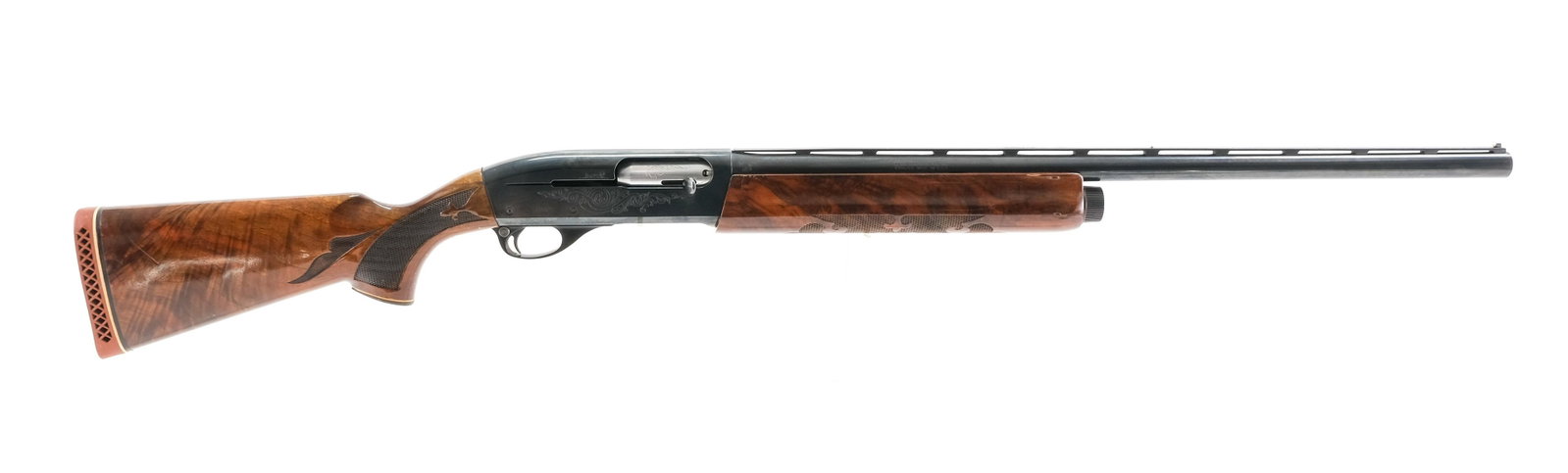 Remington 1100 12ga Semi-Auto Shotgun: Description Remington model 1100 Trap in 12 gauge 2 3/4" shells with a four round capacity and a 25" bbl, fixed SKEET choke. Rubber butt pad ,still supple with moderate wear. Premium hardwood stock ha