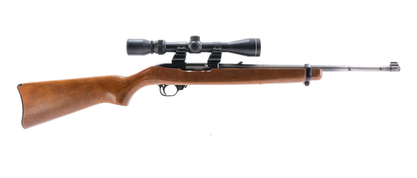 Ruger 10/22 .22LR Semi-Auto Rifle: Description Ruger model 10/22 in .22 long rifle with a removable ten round magazine and a 18" barrel. Metal butt plate with very light scuffs and scratches. One piece wood stock, light scratches, ding
