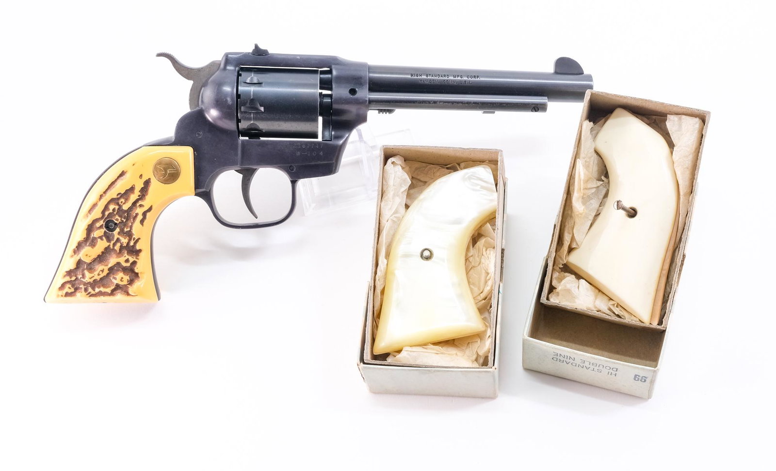 Hi-Standard W-104 Double Nine .22 D/A Revolver: Description Hi-Standard W-104 Double Nine in .22 caliber with a nine shot capacity and a 5 1/2" barrel. Composite grip plates made to look like bone. Black finished frame, cylinder and barrel. Fixed b