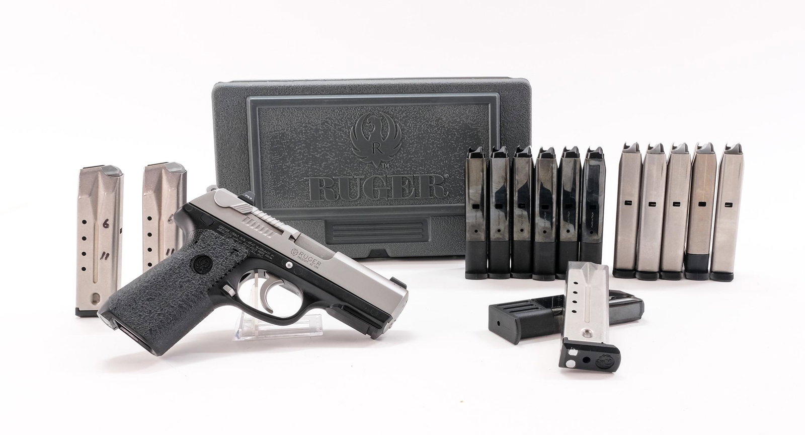 Ruger P95 9mm Semi-Auto Pistol: Description Ruger model P95 in .9mm with fifteen removable magazines. Eight are eleven round by Ruger. Seven are ten round magazines made in Italy by "Mec-Gar". Grips are wrapped in grip tape. Composi