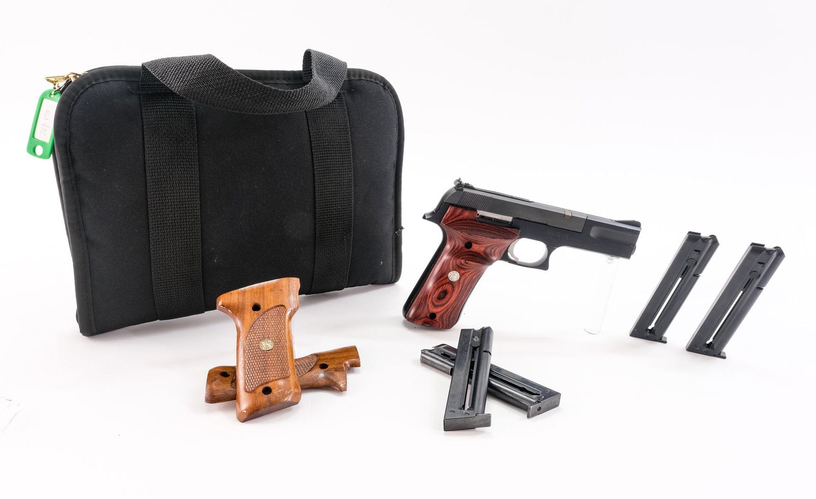 Smith & Wesson 422 .22 LR. Semi-Auto Pistol: Description Smith & Wesson model 422 in .22 long rifle with five, twelve round removable magazines and a 4" barrel. Upgraded wooden grip plates by Smith & Wesson. Black finished frame, and slide. Rear