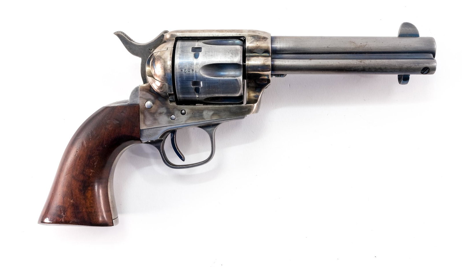 Cimarron/Uberti SAA .45 Colt Revolver: Description Cimarron/Uberti single action army revolver in .45 Colt with a six round capacity and a 4 3/4" barrel, made in Italy. Solid wooden grip plates. Case colored frame, blued barrel, cylinder, 