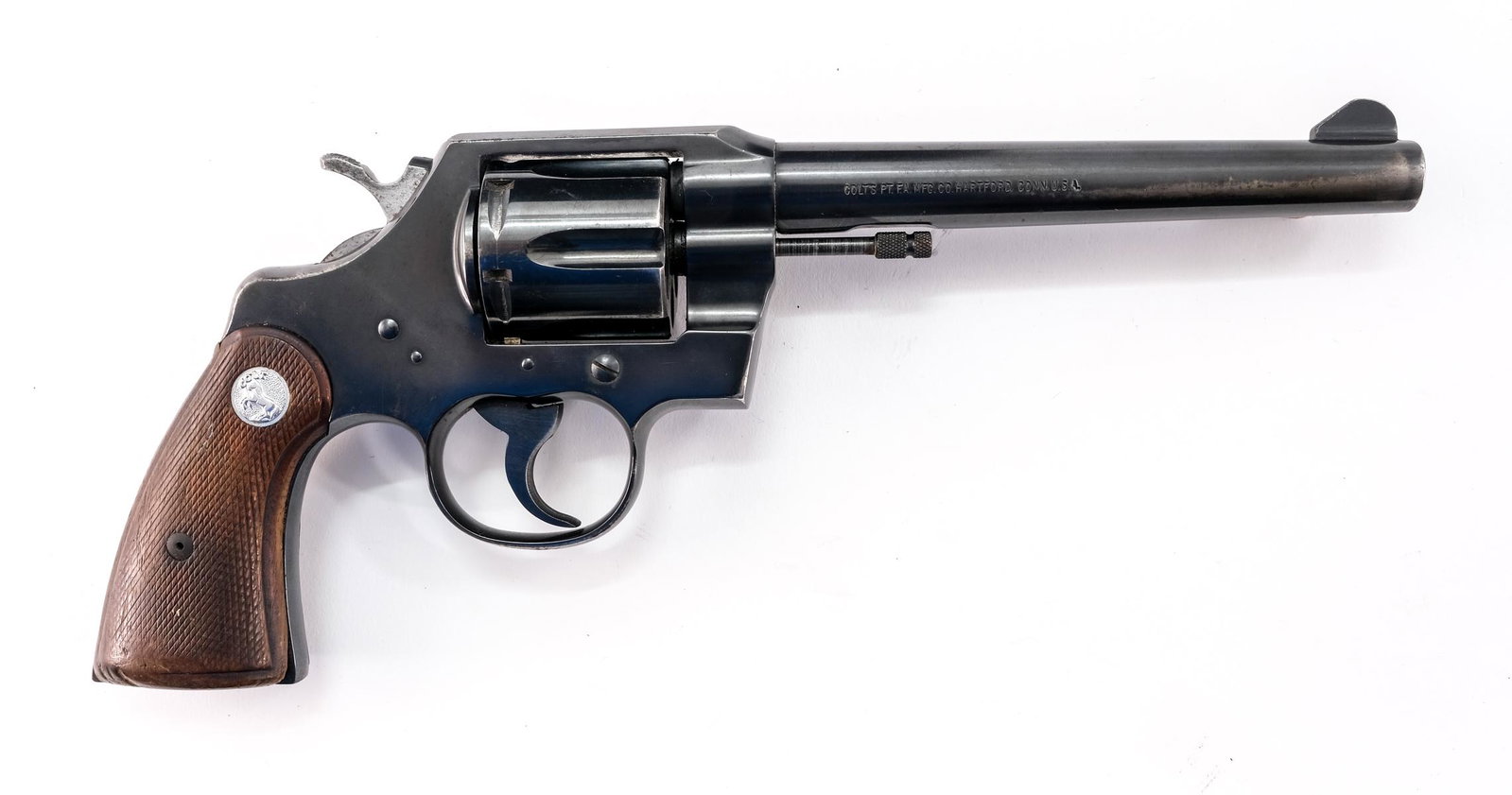 Colt Official Police .38 SPL Revolver: Description Colt Official Police in .38 SPL (Special) with a six shot capacity and a 6" barrel. Checkered wooden grip plates. Blued frame, cylinder and barrel. Fixed blade front sight, serrated trigge