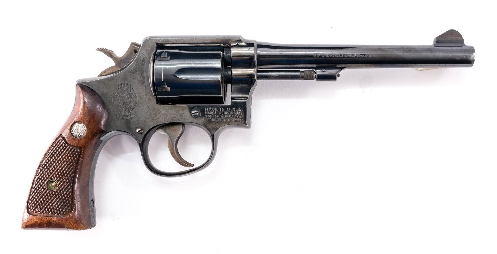 Smith & Wesson 10-5 .38 SPL Revolver: Description Smith & Wesson model 10-5 in .38 SPL (Special) with a six round capacity and a 6" barrel. Wooden checkered grip plates. Blued frame, cylinder, and barrel. Case colored serrated trigger and