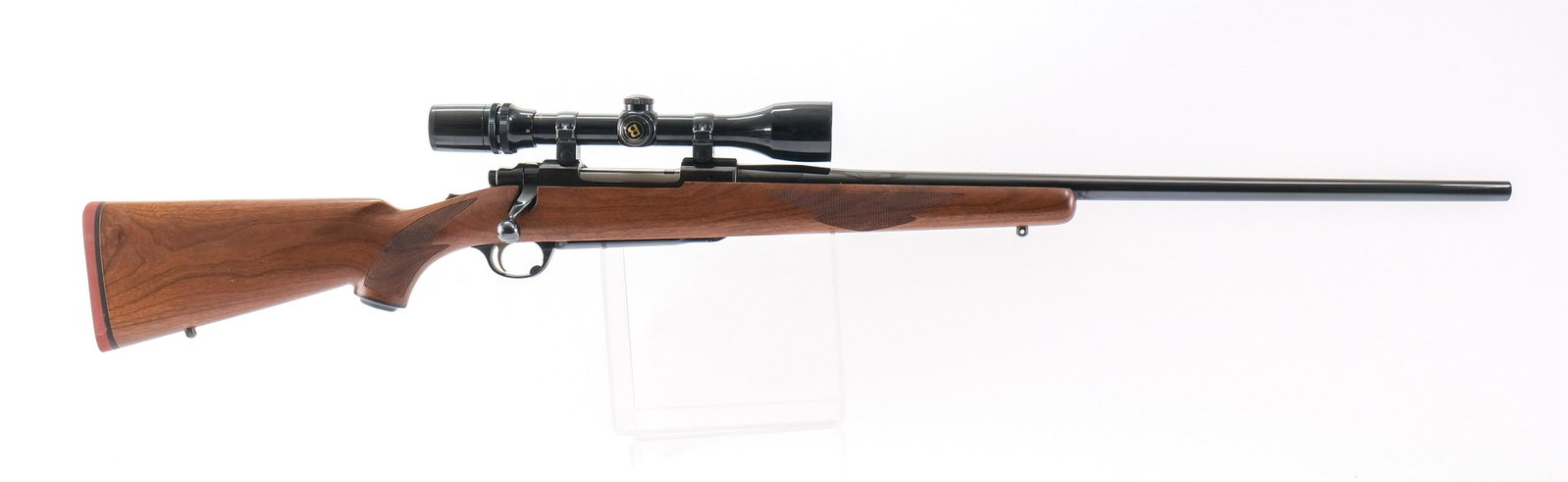 Ruger M77 .25-06 Remington Bolt Action Rifle: Description Ruger model M77 in 25 06 Remington with a five round internal magazine capacity and a 24" barrel. Rubber butt pad. Solid one piece checkered wood stock. Blued bolt, receiver and barrel. Bl