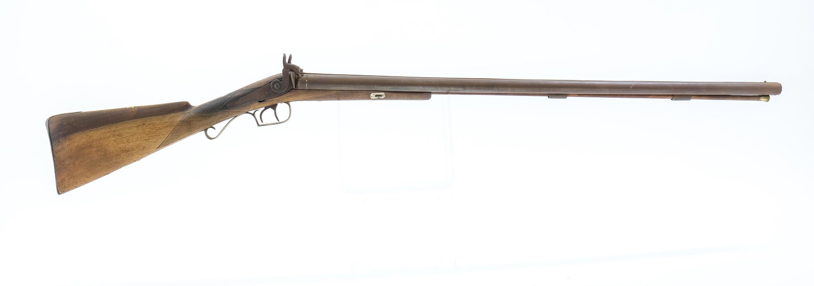 Belgium SxS 16ga Shotgun: Description Belgium made side by side black powder percussion shotgun in 16 gauge with a two shot capacity and a 31.5" barrel. Metal butt plate. Checkered wood stock with foregrip. Brass trigger guard