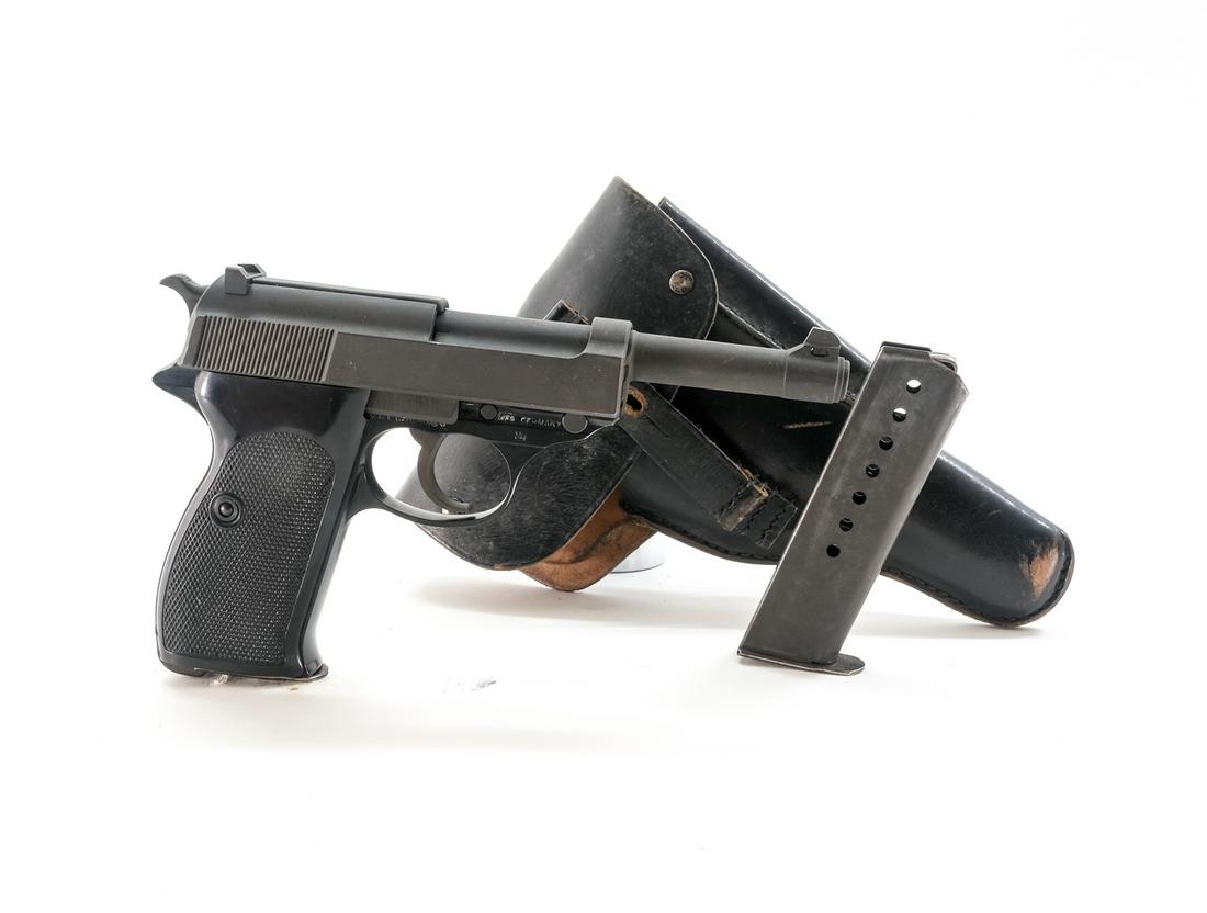 Walther P1 / P38 9mm Semi-Auto Pistol: Description Walther model P1 in 9mm with two, ten round removable magazines and a 5" barrel. Made in Germany and imported by C.A.I. Georgia VT. Checkered plastic grip plates. Black finished frame. Par