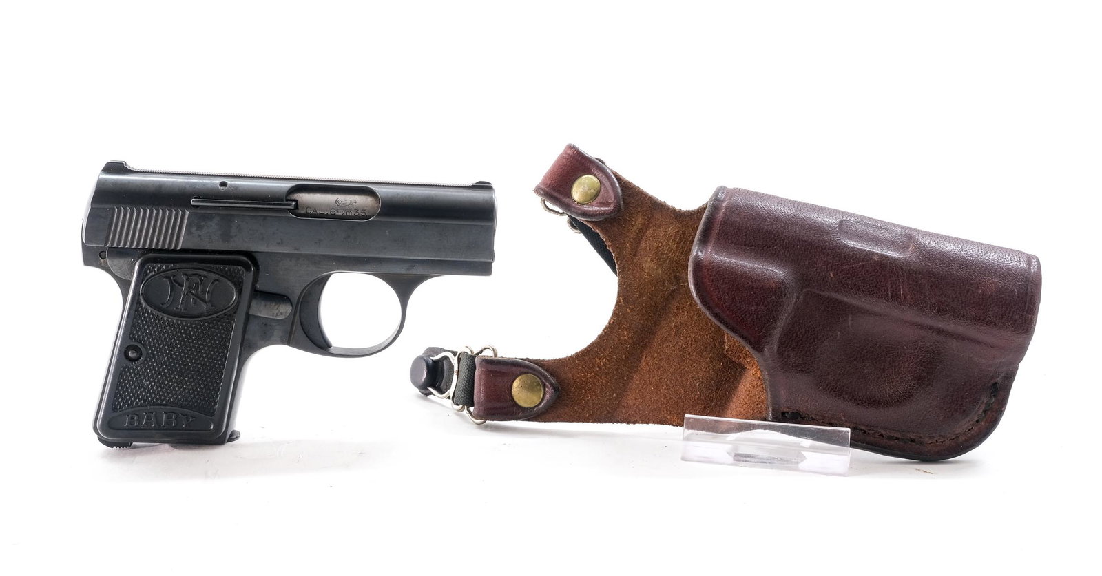 FN / Browning Baby .25 ACP Semi-Auto Pistol: Description FN / Browning Baby in 6.35mm which is .25 ACP (Automatic Colt Pistol) with one, six round removable magazine and a 2" barrel. Made in Belgium marked with FN marked grip plates. Plastic che