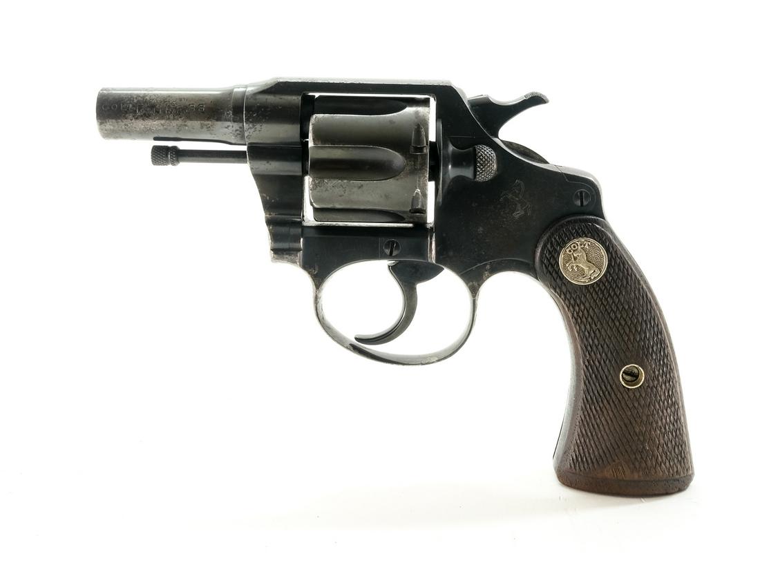Colt Police Positive .38 S&W Revolver: Description Colt Police Positive in .38 S&W (Smith & Wesson) with a six shot capacity and a 2 3/8" barrel. Checkered Colt medallion wood grip plates. Blued frame, cylinder, barrel, checkered hammer an