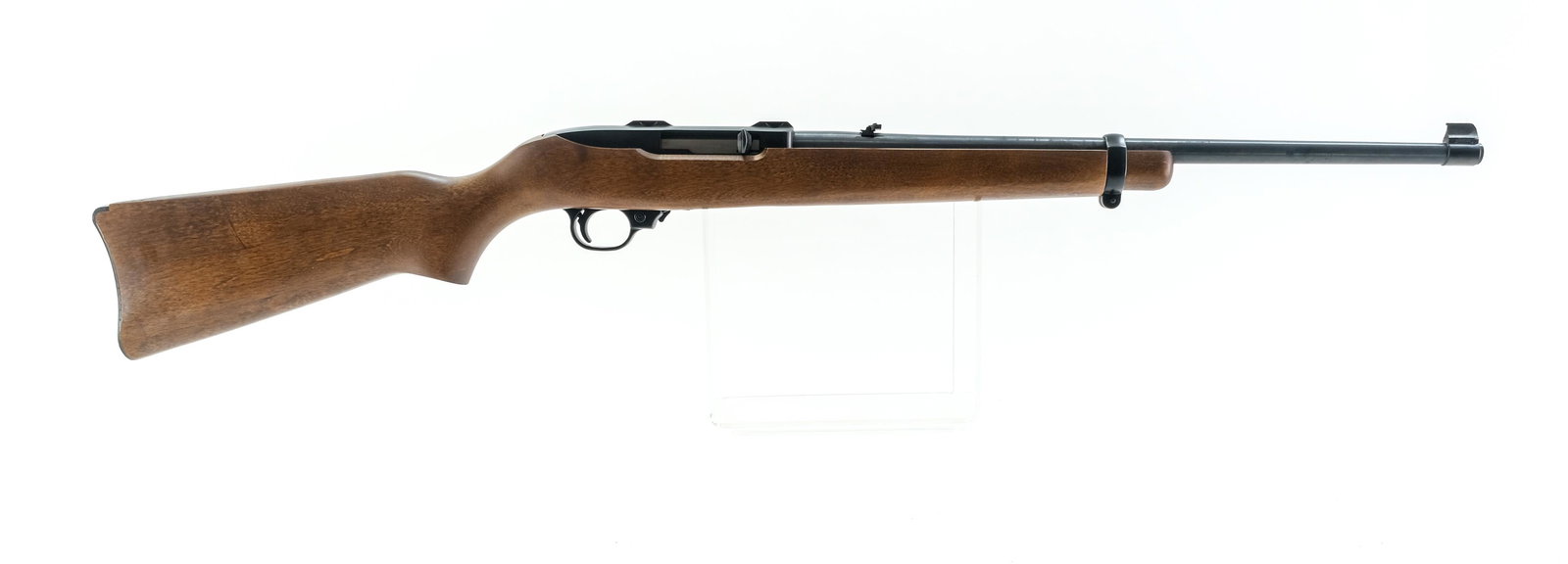 Ruger 10/22 .22 Mag Semi-Auto Rifle: Description Ruger 10/22 in .22 Win Mag with a ten round removable rotary magazine with a 18.5" barrel. Metal butt plate. Solid wood stock and front foregrip. Blued receiver and barrel. Black finished