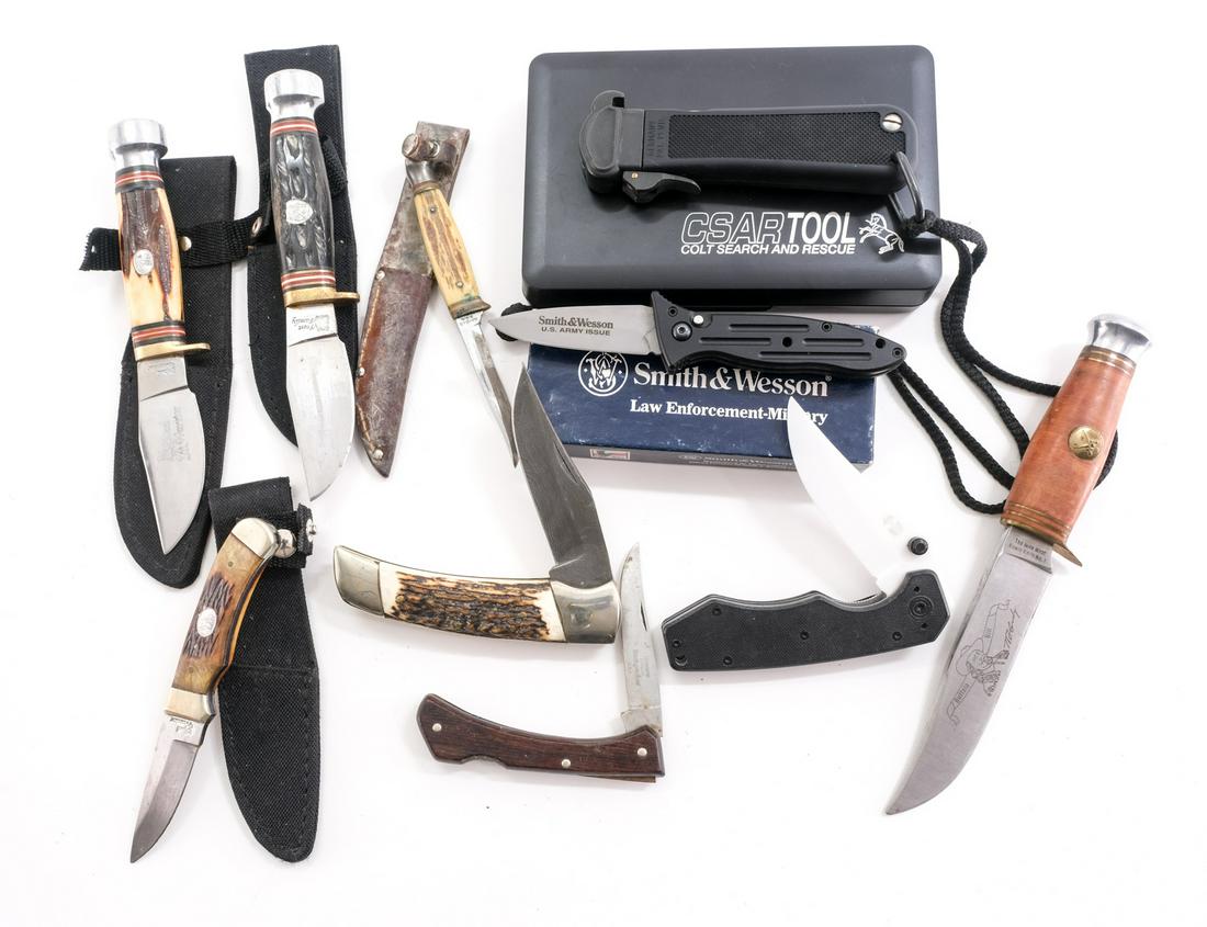 Knife Lot, Colt, Mossberg, S&W: 9 knives total by various manufacturers. Some folding some fixed. Colt search and rescue tool is most notable. Mossberg ceramic blade. S&W LEO-Military. Most look unused with some pieces having oxidat