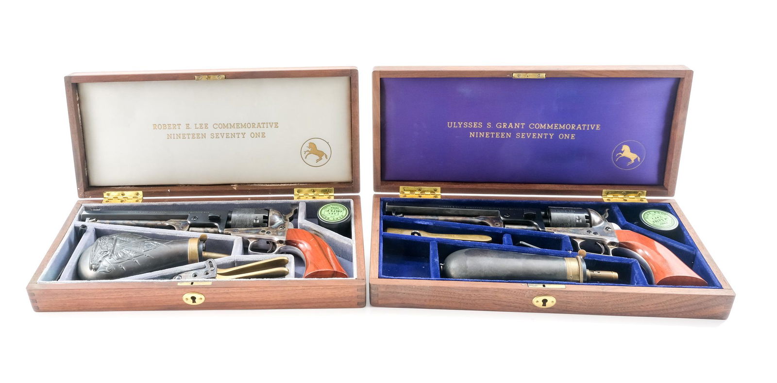 Matched Pair of Colt 1851 Navy 2nd Gen Pistols: Description Matched Set of Two Commemorative Colt 1851 Navy Percussion Cap Pistols in fitted cases with accessories. Each 1971 Robert E. Lee and Ulysses S. Grant. with Case Colored Frames, hammers, an