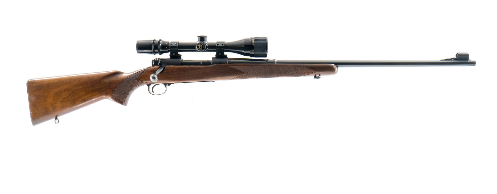 Winchester 70 .30-06 (1950) Bolt Action Rifle: Description Winchester Model 70 in .30-06 Springfield with a four round internal capacity and a 24" barrel. Metal checkered butt plate. Solid smooth checkered wood stock and front foregrip. Blued rece