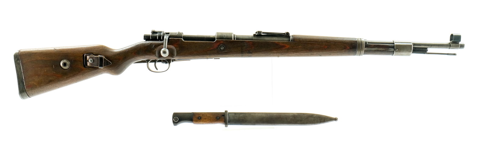 JP Sauer & Sohn "CE 42" K98 8MM Bolt Action: Description WWII German "CE 42" code K98 bolt action rifle chambered in 8MM Mauser. This example with serial number 4334b was manufactured by J.P. Sauer & Sohn, Suhl in 1942 and features a complete se