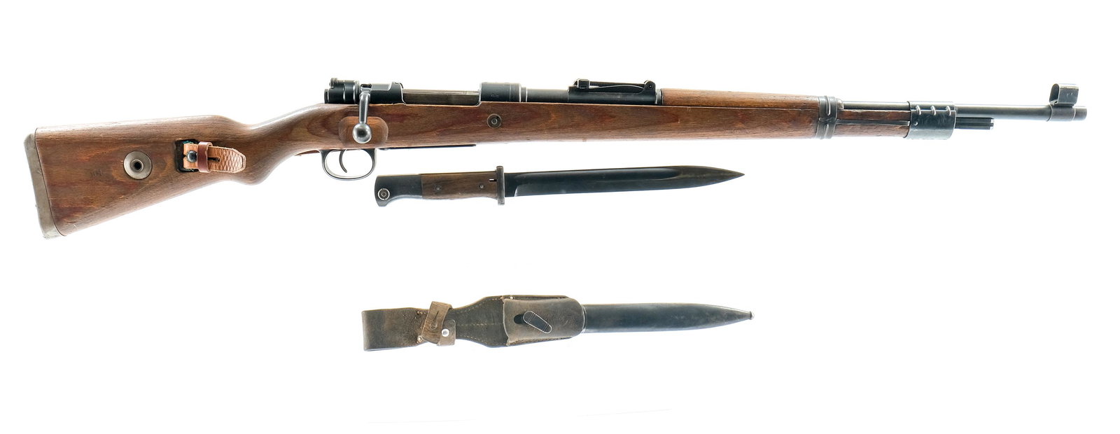 Waffenwerke Bruenn "dot 1944" K98 Bolt Action 8MM: Description WWII German Waffenwerke Bruenn model K98 bolt action rifle chambered in 8MM. This "dot 1944" code rifle with serial number 5564 features a 24" barrel with hooded front and tangent rear sig