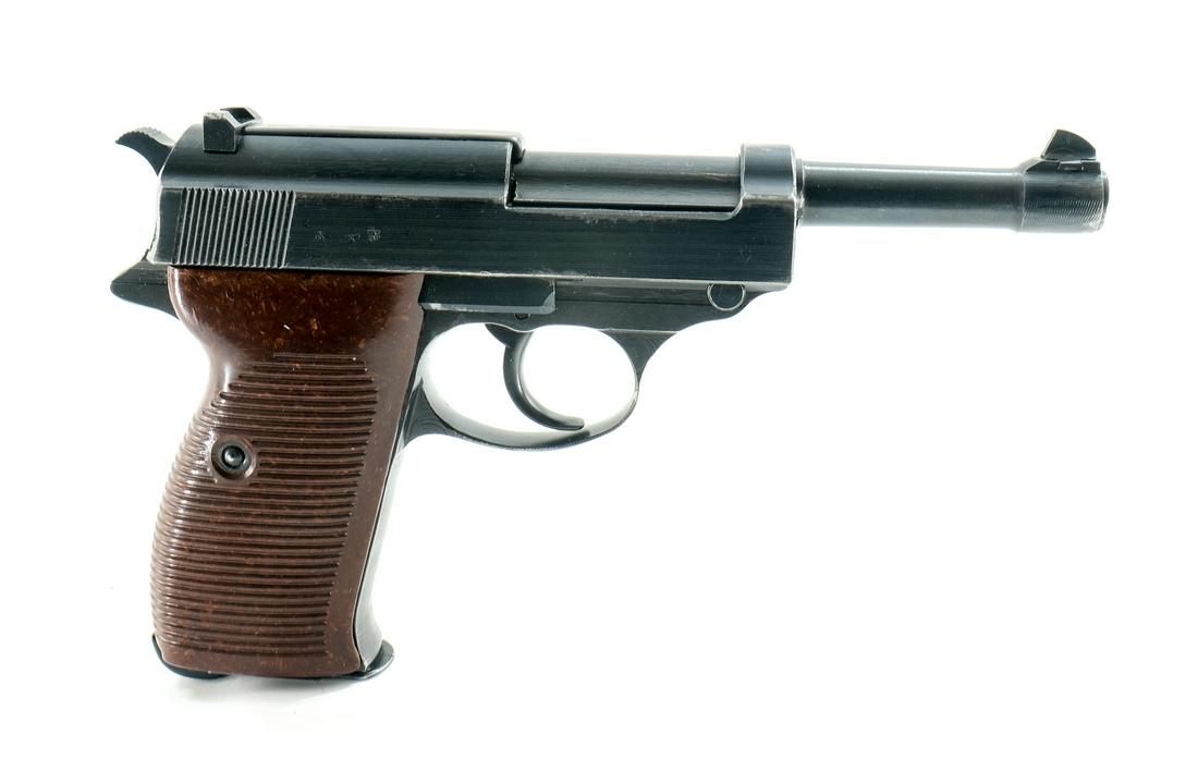WWII German Spreewerke P38 9mm Pistol: Description Third Reich German World War Two 9mm luger Pistol. Matching Serial numbers on frame left, Slide left, and barrel bottom front. Orignal Bakelite stocks. With one original magazine stamped "