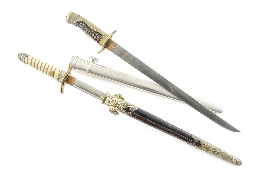 Two WWII Japanese Daggers: Description An 1883 Pattern Naval Dagger with Gilt Brass mounts, Ray Skin Handle and leather scabbard. Single edge sharpened blade with fuller. overa l lmeasurement (in scabbard) is 39.5 CM (15.5") go