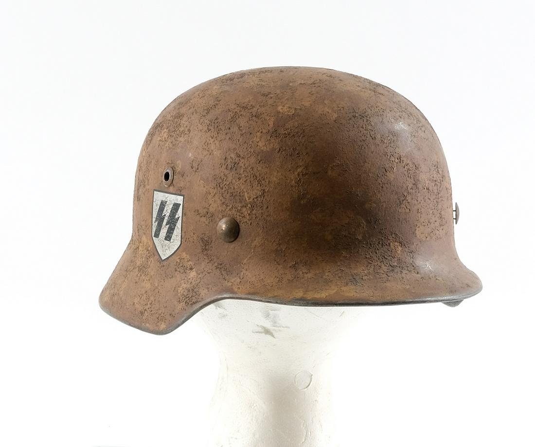 German WWII Third Reich M35 NS-68 SS Helmet: Description Double Decal M35 SS Helmet. Having a 1939 Dated Liner band and stamped "60, 35" leather liner. Rolled edge shell is stamped E174 (rear) and NS.68 left side. No Dome stamp (painted over?) R