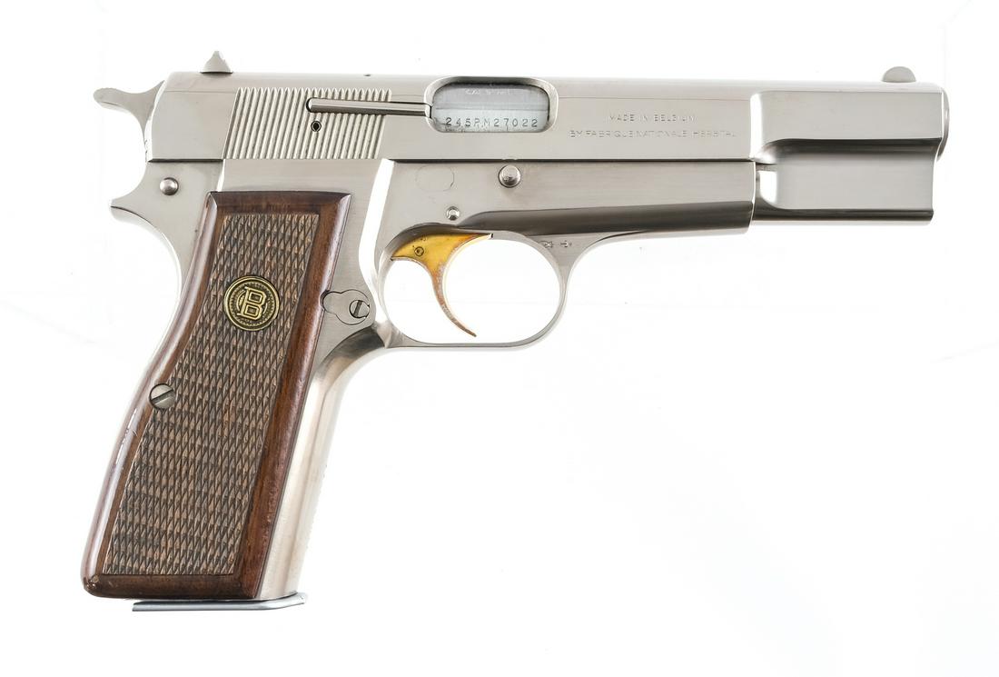 Browning Hi-Power 9mm (1980) Semi-Automatic Pistol: Description Browning Hi-Power in 9mm with one, thirteen round (High Capacity) magazine with a 4.5" barrel. Made in Belgium by FN (Fabrique Nationale Herstal). Browning checkered wood grip plates. High