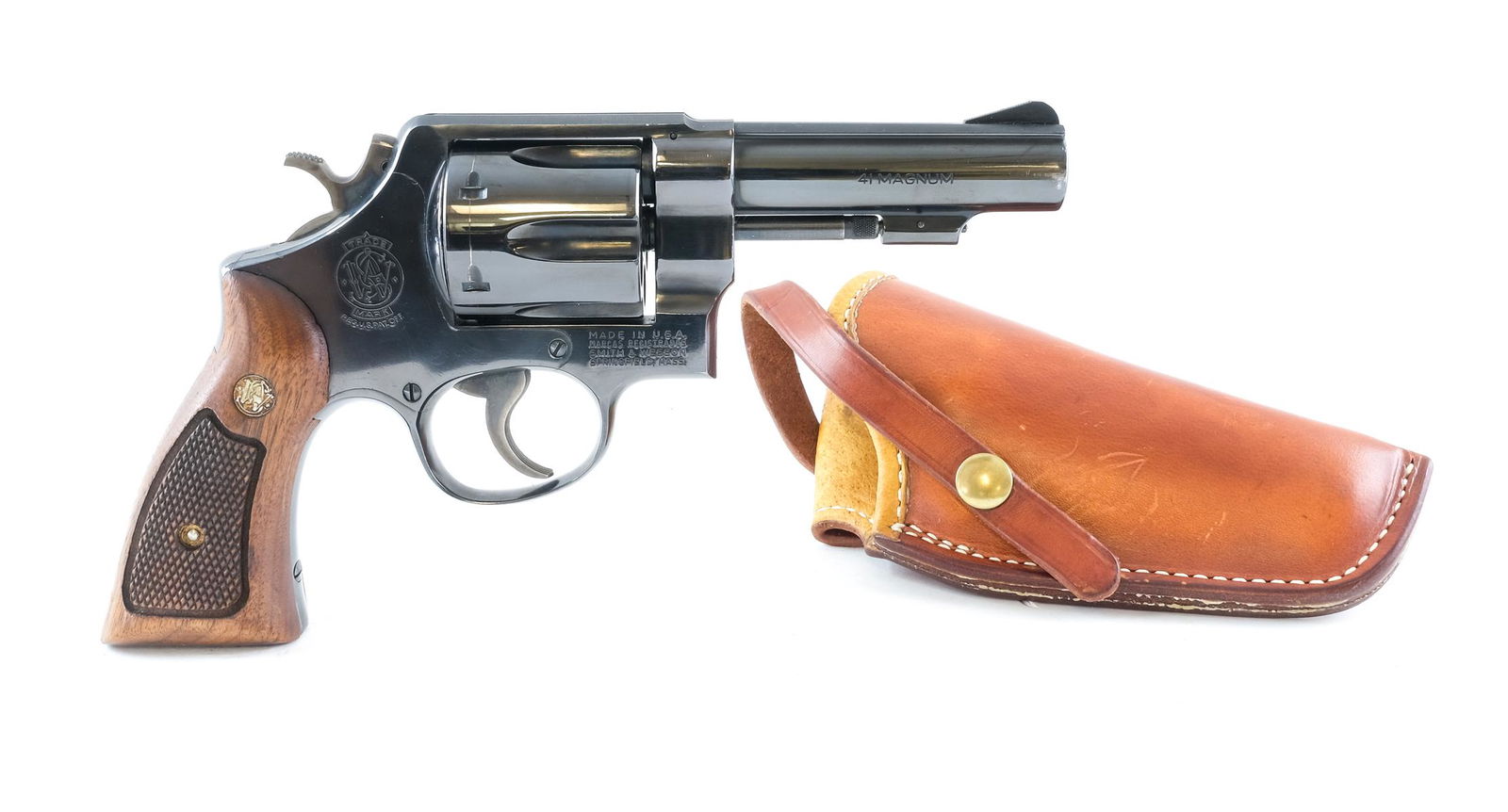 S&W 58 .41 Mag Revolver: Description Smith & Wesson Model 58 in .41 Magnum with a six round cylinder capacity and a 4" barrel. S&W checkered walnut grip plates. Blued frame, cylinder and barrel. Case colored serrated trigger