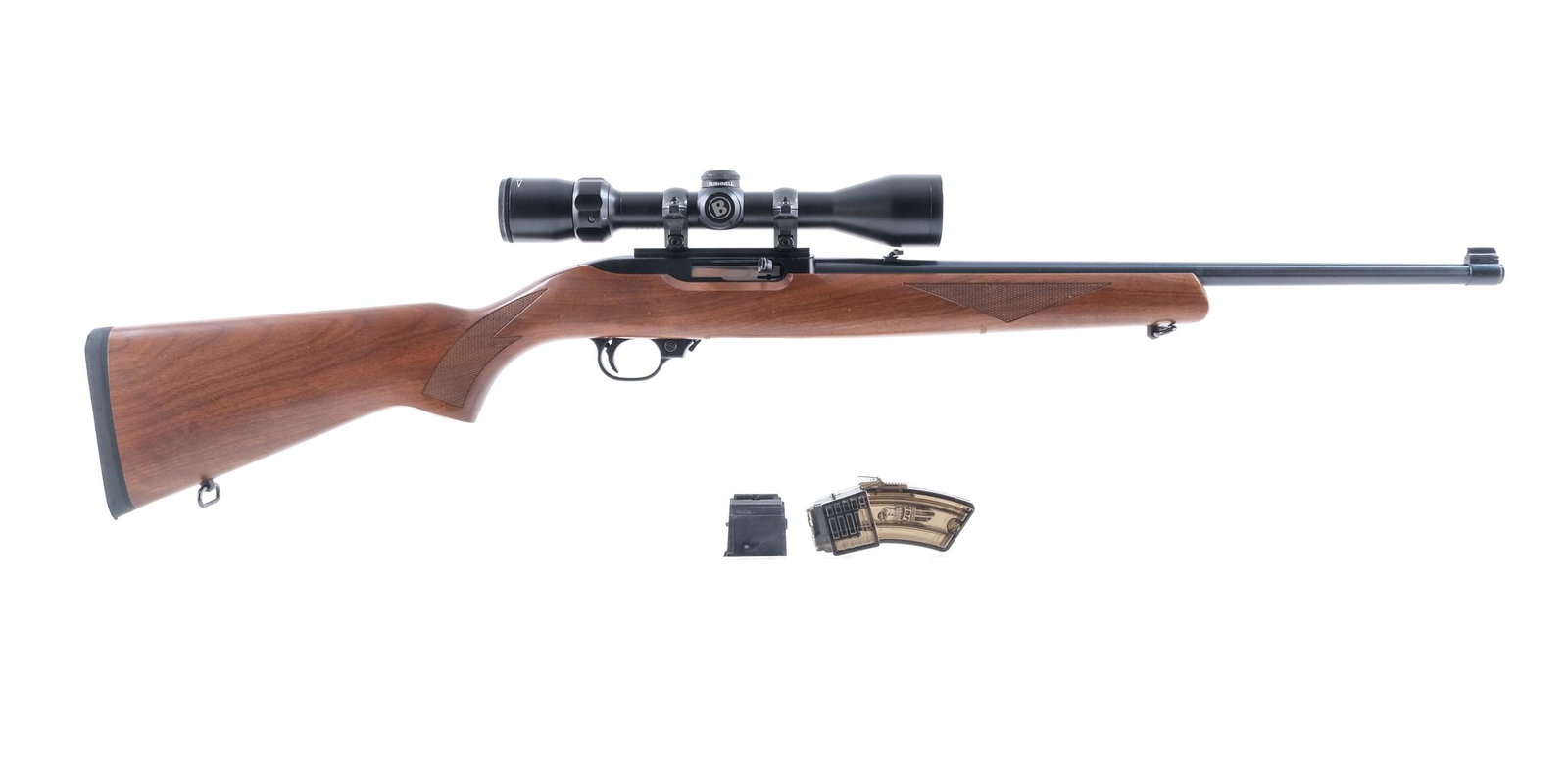 Ruger 10/22 22 LR Semi-Auto Rifle: Description Ruger Model 10/22 in .22 Long Rifle with three, ten round rotary magazines and a 18.5" barrel. Ruger rubber butt pad. Checkered wood stock and front foregrip. Blued receiver, smooth trigge