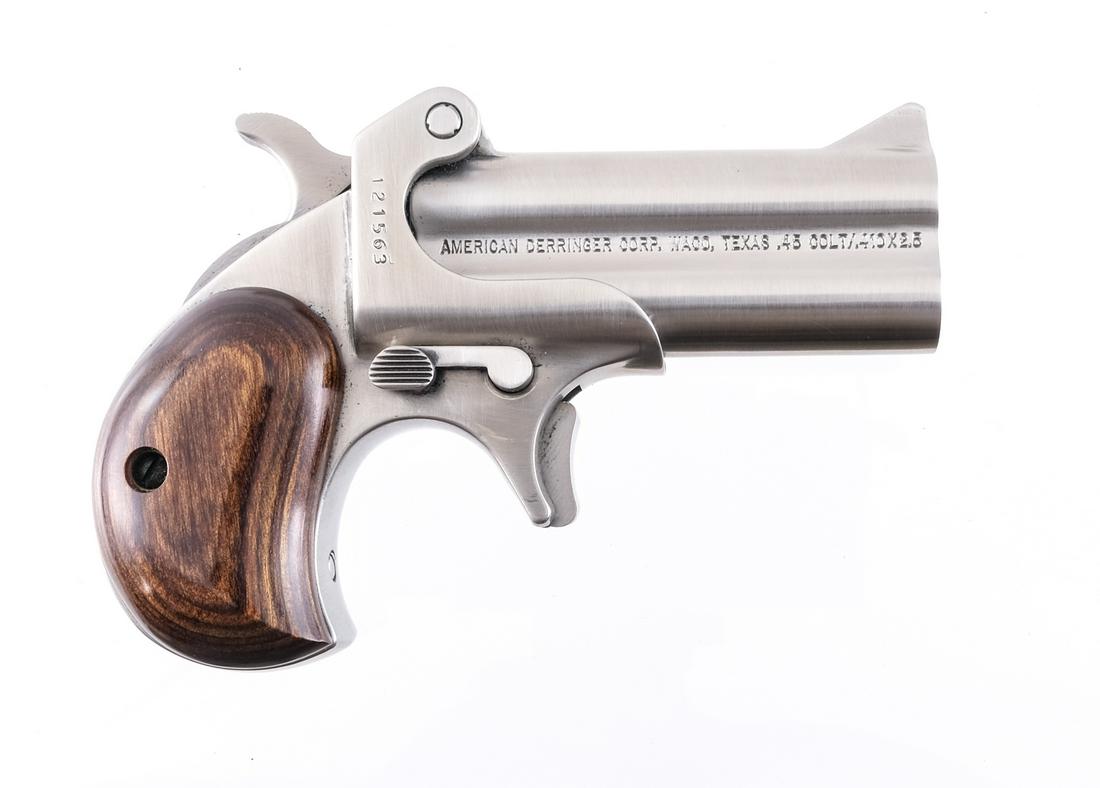American Derringer M1 .45 Colt - 410 Pistol: Description American Derringer Model M-1 in .45 Colt or .410 Gauge with a two round capacity and a 3" over under double barrel. Smooth laminated wood grip plates. Polished stainless steel frame and ba