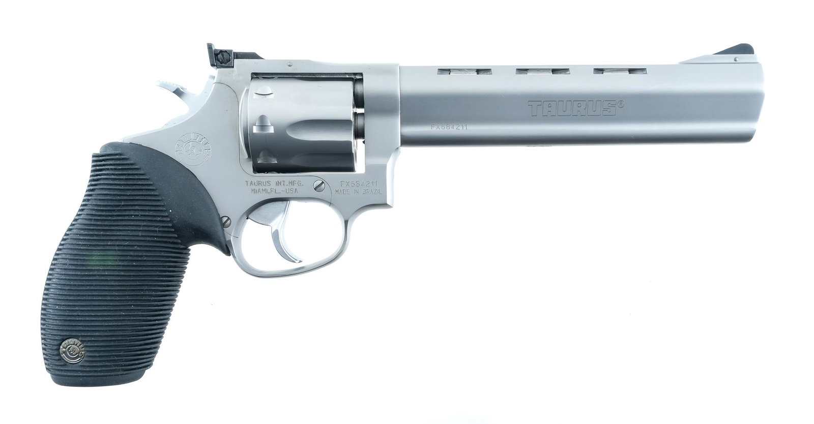 Taurus Tracker 990 .22LR Revolver: Description Taurus Tracker 990 in .22 LR with a nine round cylinder capacity and a 6.5" barrel. Made in Brazil. Factory barrel cuts to reduce weight. Taurus serrated rubber grip plates. Matte finished