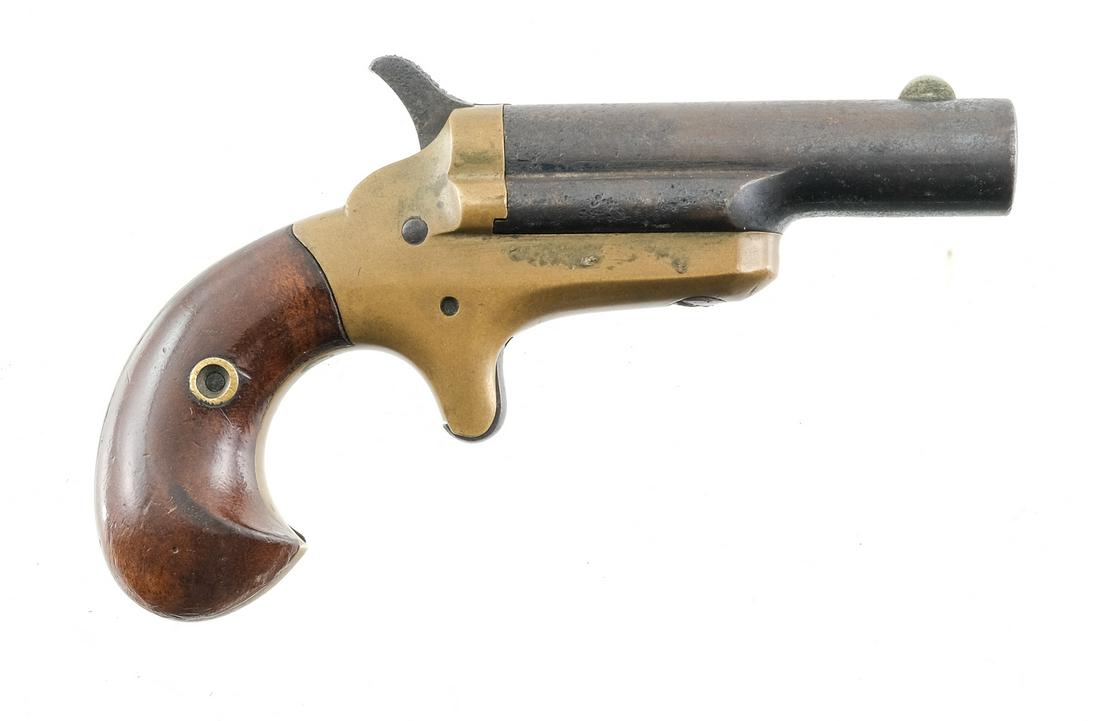Colt 3rd Model Derringer .41 RF: Description Early third model pocket derringer chambered in .41 Rim Fire Brass frame, blued barrel and wood grips. "COLT" on top of barrel. 2.5" slide pivoting barrel, single shot. Wood grips have a d